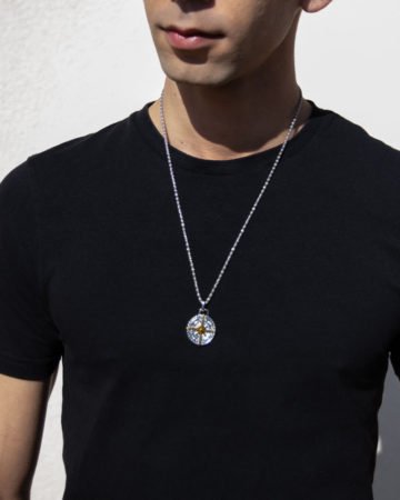 model wearing mens metal compass necklace