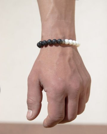 model wearing black and white bead bracelet