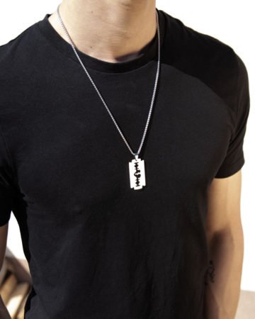 model wearing razor blade heart pendant necklace
